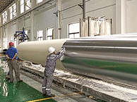 Vapor barrier film wrapping applied to trimmed insulation pipe sections